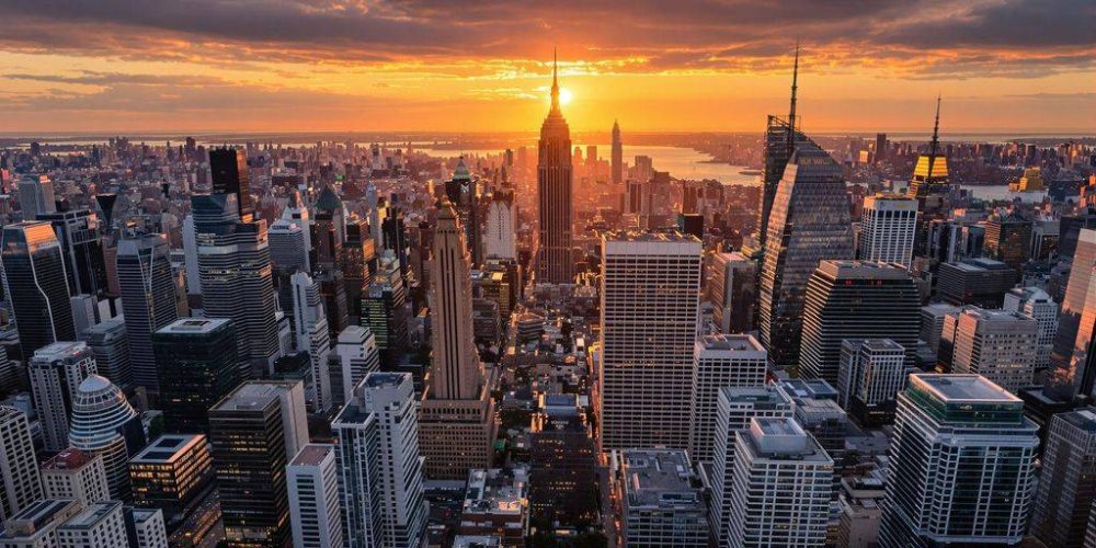 Skyscrapers at sunset in a financial district.