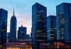 Dynamic skyline of a financial district at twilight.
