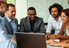 Group of investors discussing strategies around a table.