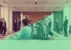 Professionals discussing finance in a modern office setting.