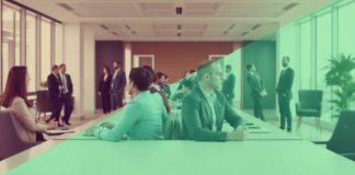 Professionals discussing finance in a modern office setting.