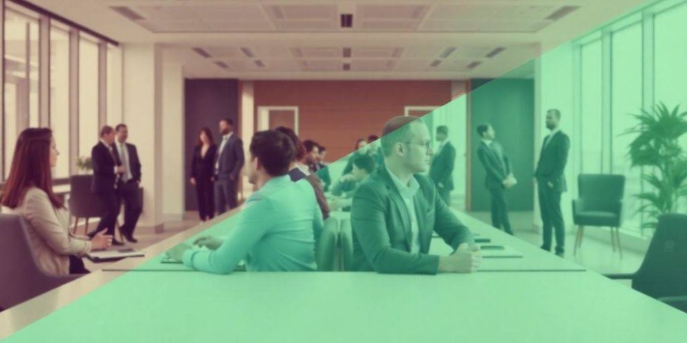 Professionals discussing finance in a modern office setting.