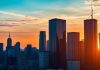 City skyline at sunset representing investment opportunities.