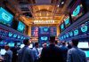 Traders engaged in lively discussions on a trading floor.
