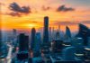 Dynamic cityscape at sunset illustrating market volatility.