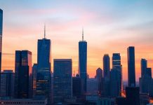 Urban skyline at twilight representing private equity future.