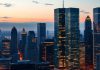 City skyline at dusk, reflecting innovation and finance.