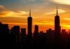 City skyline at sunset reflecting financial growth and trends.