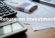 Calculator and financial documents on a desk.