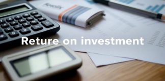 Calculator and financial documents on a desk.