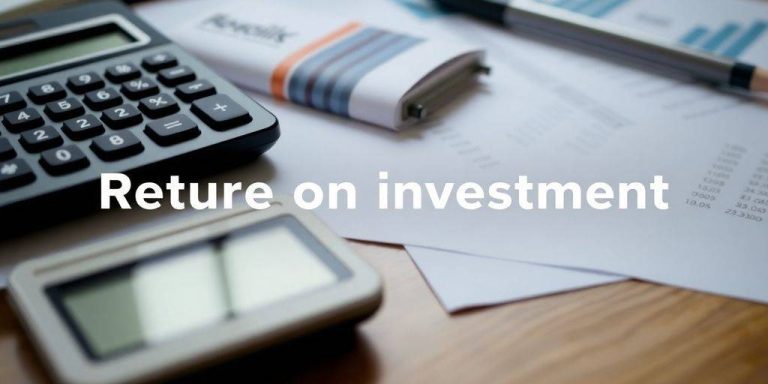 Calculator and financial documents on a desk.