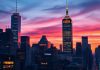City skyline featuring major US stock exchanges at dusk.