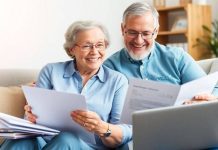 Happy couple discussing retirement plans at home.