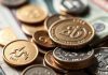 Coins and banknotes arranged to illustrate investment concepts.