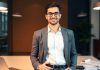 Young professional in finance setting, ready to start career.
