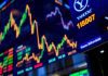 Colorful stock market display with dynamic trading floor atmosphere.
