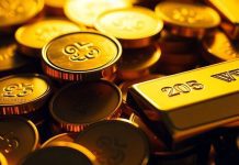 Gold coins and bars glowing in soft, inviting light.