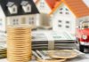Gold coins, stack of cash, and a house model.