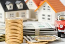 Gold coins, stack of cash, and a house model.