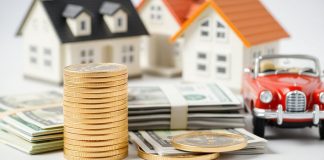 Gold coins, stack of cash, and a house model.