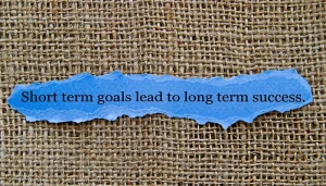 How can short-term goals lead to achieving long-term goals