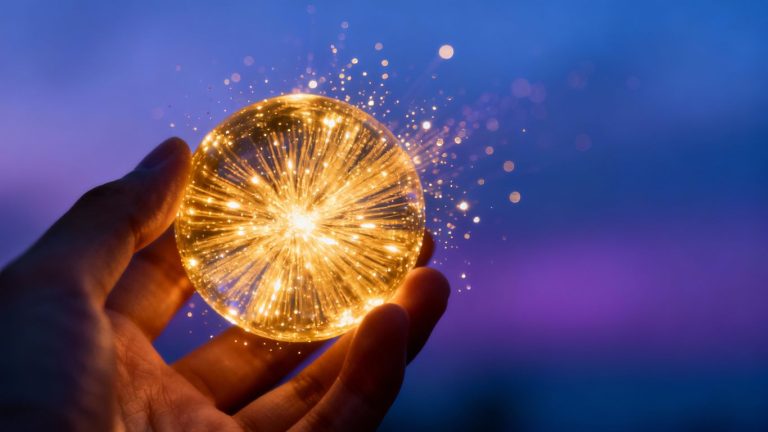 Hand holding glowing orb of financial growth.