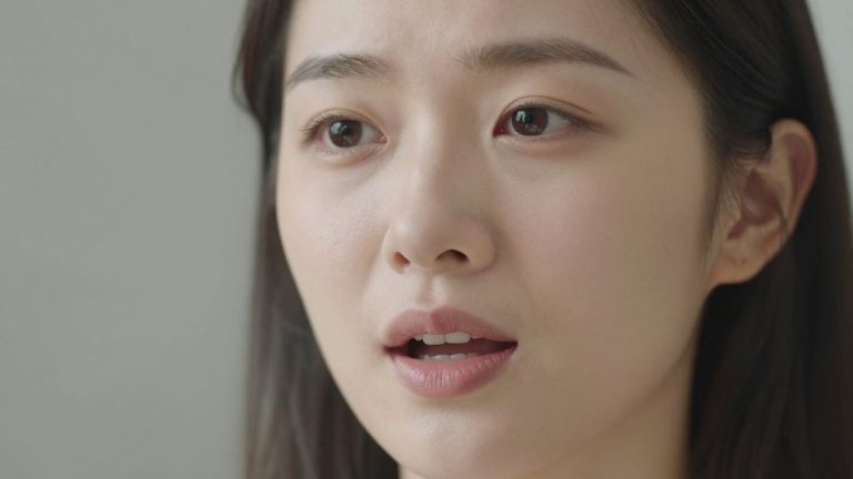 Person speaking clearly, focusing on mouth and enunciation.