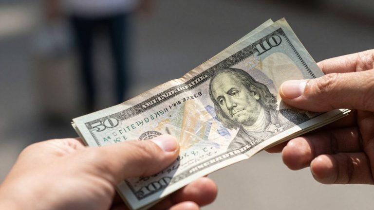 Hand holding cash, quick loan concept