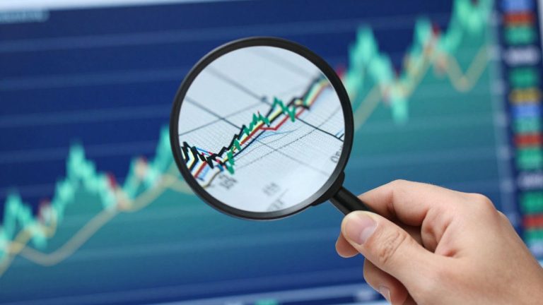Magnifying glass over financial chart